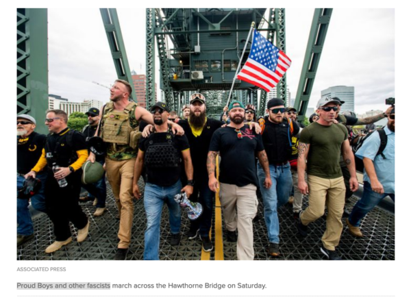 Picture of proud boys being protected by police in portland