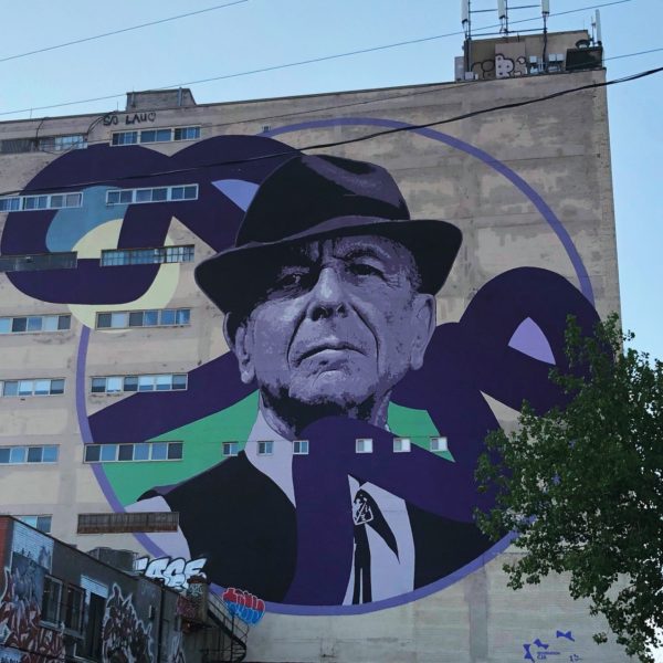 A mural of Leonard Cohen fills the side of a building in Montreal's Plateau neighborhood.