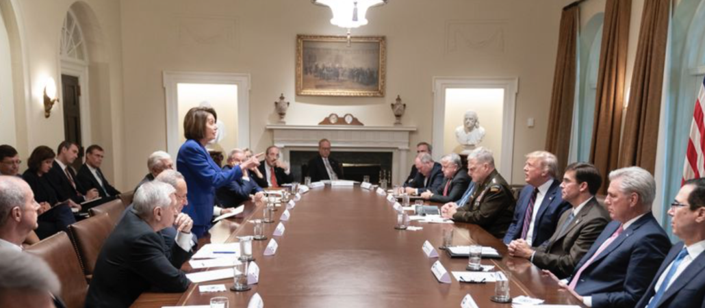 nancy pelosi, standing, finger pointed at trump, shaming him and all the cabinet members and generals