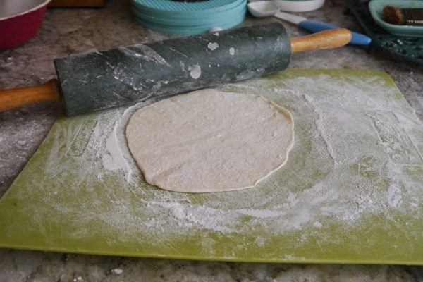 rolling out tortillas