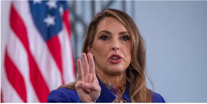image of ronna mcdaniel holding up three fingers