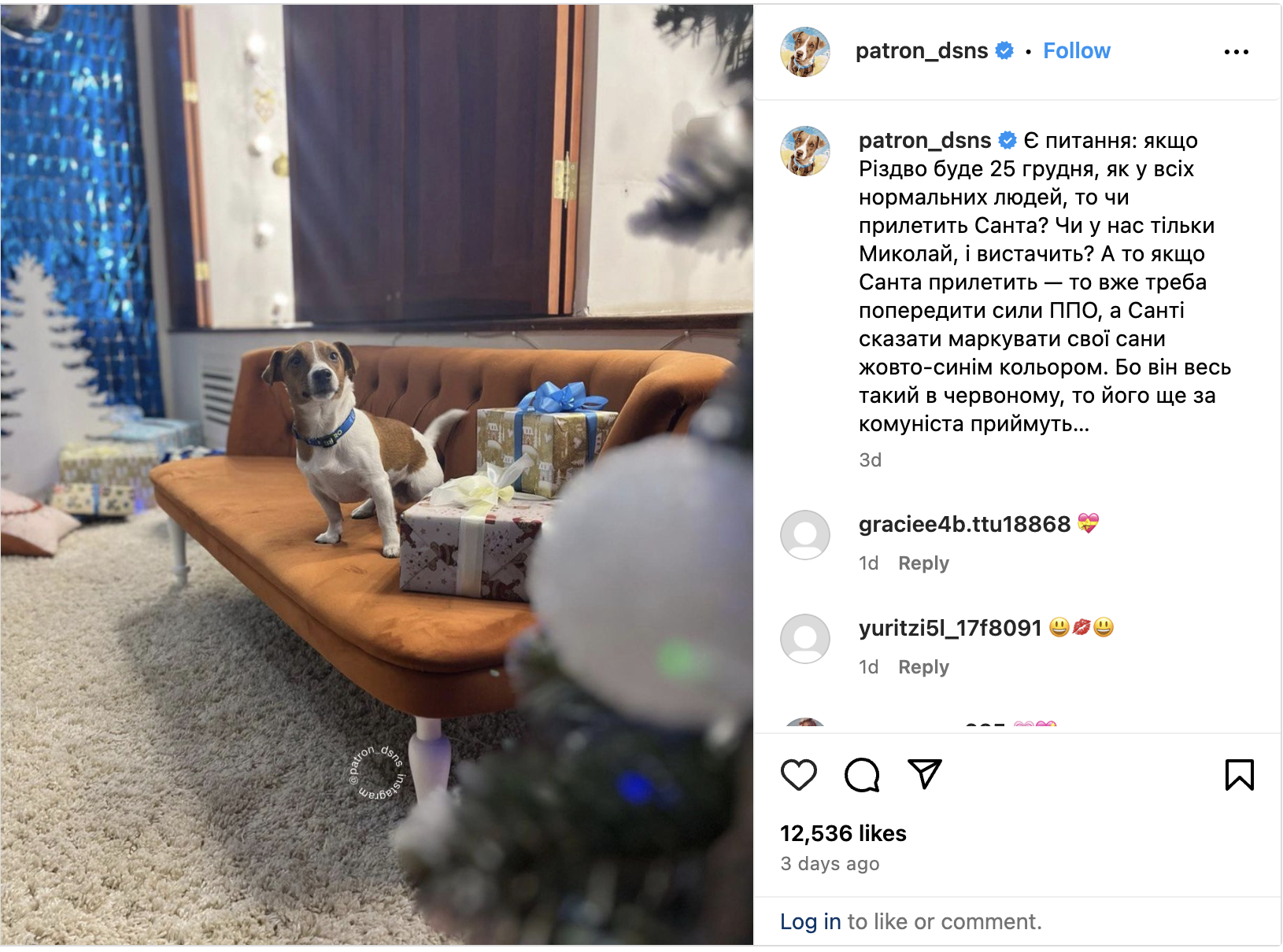Screen grab of a picture of Patron the sapper dog from his official Instagram. The picture is from 19 DEC 2023. Patron is a short haired Jack Russell terrier. He is wearing a blue Patron Ukraine collar and is standing on a chocolate brown colored couch next to several wrapped presents. In the right foregroud are branches from a Christmas tree. The caption, which is written in Ukrainian Cyrillic, machine translates as: "Christmas will be on December 25, like all normal people, so will Santa come? Or will we just have St. Nicholas and that's it? If Santa does come, then we should warn the air defense forces and tell Santa to mark his sleigh with yellow and blue colors. Because he's all dressed in red, they'll take him for a communist..."