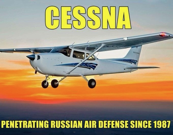 A picture of a white cessna flying with a sunset sky behind it. The The caption is in yellow. Above the plane it reads; "CESSNA". Below the plane: "PENETRATING RUSSIAN AIR SPACE SINCE 1987". 