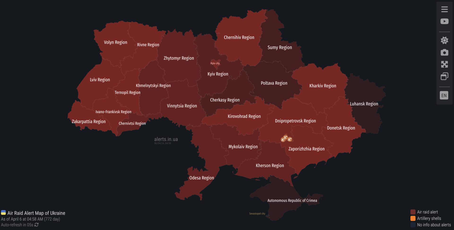 Screen grab of the air raid alert map for Ukraine. It is from 9:58 PM EDT and the entire country is under air raid alert. Every oblast/region is colored red or dark red.
