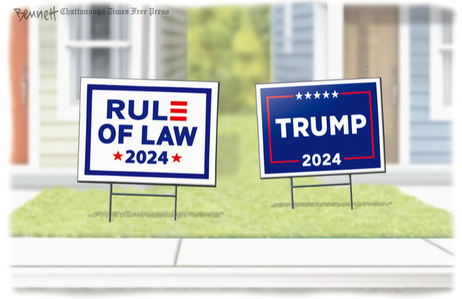 Two political yard signs.  One reads 