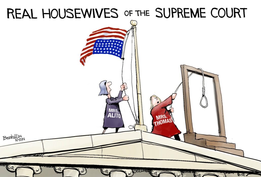 Caption:  Real Housewives of the Supreme Court.  Image:  Mrs. Alito and Mrs. Thomas standing on the roof of the Supreme Court.  Mrs. Alito is raising an upside-down American flag and Mrs. Thomoas is slinging a noose over a gallows.