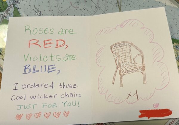 Homemade card with a drawing of a wicker chair and poem that say, “Roses are red, violets are blue. I ordered those cool wicker chairs just for you!”