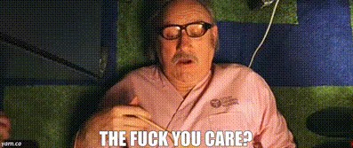 Still from The Royal Tenenbaums showing Gene Hackman as Royal, lying on his back in pink pajamas. The caption is THE FUCK YOU CARE?
