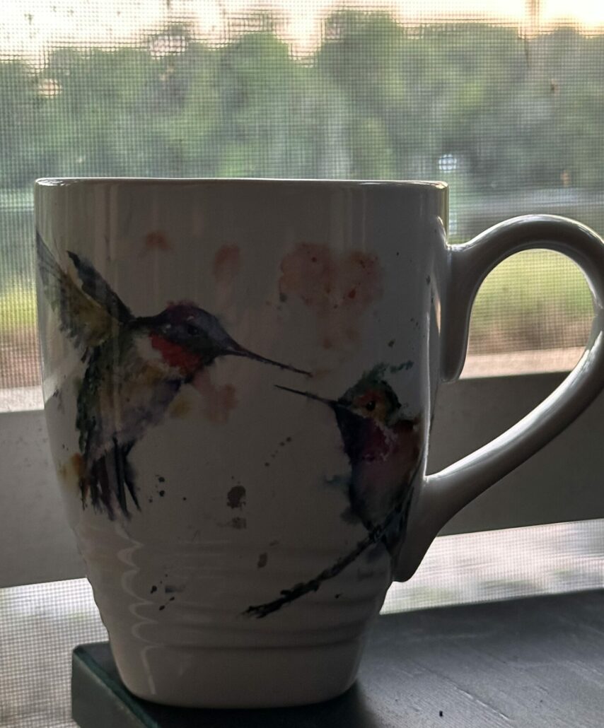 Coffee mug with a hummingbird graphic
