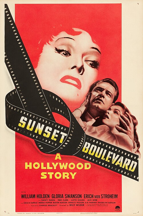 Movie poster. A predominantly red illustration of an older woman's wrathful, enraged face looming large over a frightened younger couple; the title 'Sunset Boulevard' is displayed over a strip of celluloid film tied in a knot.